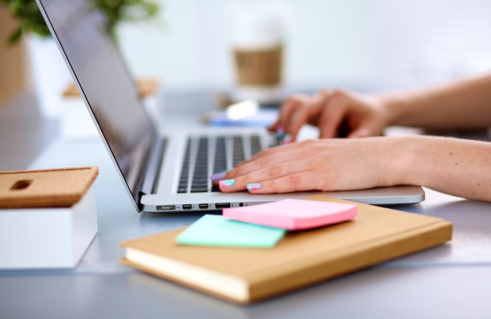 A young businesswoman working on a laptop .